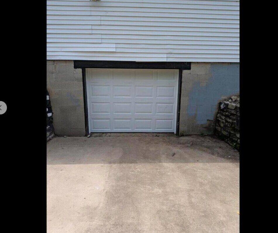 New residential garage door installed clean and level